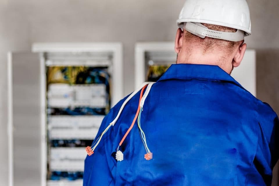 Three D Power Light electrician working at an electrical panel