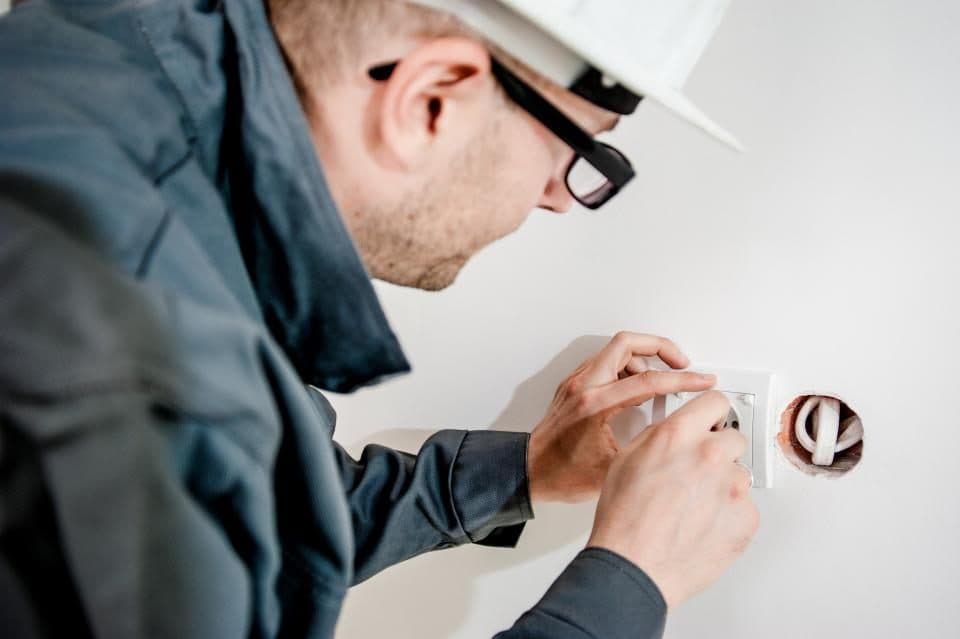 Licensed electrician installing an outlet on a residential job in Toronto
